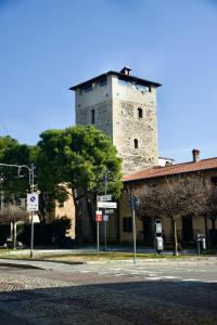 a building with a tower on top of it at Casa Vacanze La Torre in Orio al Serio