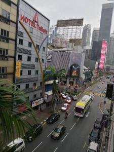 a busy city street with cars on the road at RAS International Hotel in Kuala Lumpur