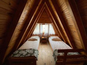 a room with two beds in a attic at SOLO in Łukęcin