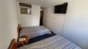 Hotel Catalina Real客房内的一张或多张床位
