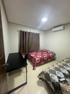 Ein Bett oder Betten in einem Zimmer der Unterkunft Aluguel por temporada em Piranhas