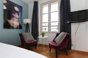 O zonă de relaxare la 402 -Studio élégant et confortable à Paris 5