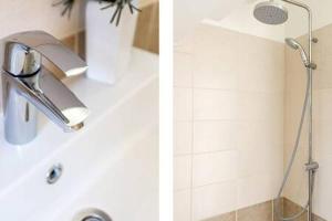 a shower head on a sink in a bathroom at Joya Cyprus Mermaid Penthouse Apartment in Saint Amvrosios +19 photos