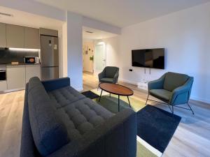 a living room with a couch and two chairs at Stay U-nique Apartment Putxet in Barcelona