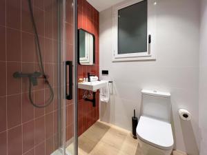 a bathroom with a toilet and a sink at Stay U-nique Apartment Putxet in Barcelona