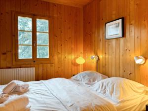 Rúm í herbergi á Chalet Marolly - Evolène