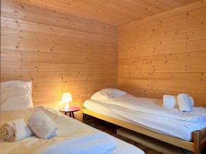 Rúm í herbergi á Chalet Marolly - Evolène