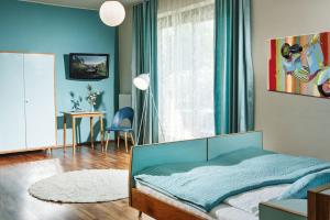 Posteľ alebo postele v izbe v ubytovaní Weingartenhotel Harkamp Südsteiermark