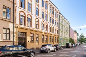 a row of cars parked in front of a building at Fantastic apartment in Oslo in Oslo