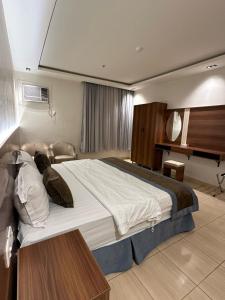 מיטה או מיטות בחדר ב-Dosh Hotel