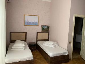 Postel nebo postele na pokoji v ubytování soprano guest house
