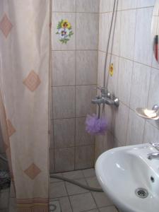 a bathroom with a shower and a sink at Soliid Apartment in Pärnu +19 photos