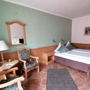 Postel nebo postele na pokoji v ubytování Hotel Farchauer Mühle + 37 fotografií