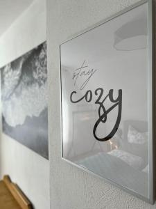 a picture of a sign that says stay cozy at Kleine Auszeit im Seenland in Hohenbocka