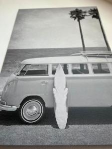a white van with a surfboard sticking out of it at Kleine Auszeit im Seenland in Hohenbocka