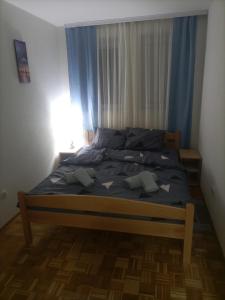 a bed with stars on it in a bedroom at JelaLux in Gornja Toplica