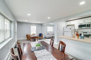 a kitchen and dining room with a table and chairs at Farmington Hills Vacation Rental, 20 Mi to Detroit in Farmington Hills