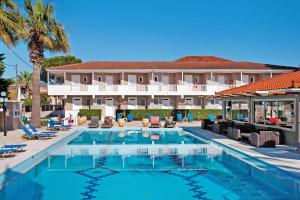 a large swimming pool in front of a hotel at Paradise Superior Studio 5 in Laganas