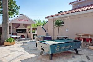 a pool table in the middle of a patio at Paradise Superior Studio 5 in Laganas