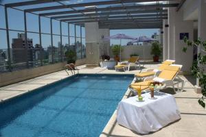 a swimming pool on the roof of a building at Ariston Hotel in Rosario
