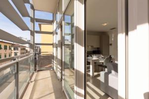 a balcony with a view of a living room at Angelico Modern Living in Florence