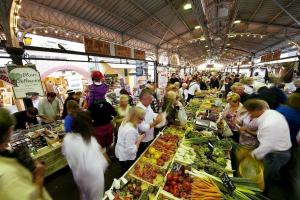 a crowd of people standing around a market with food at LE PROVENCAL - Center old Antibes 1BR flat with AC, wifi in Antibes