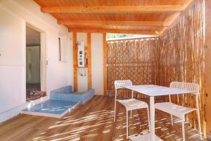 a porch with a table and chairs in a house at Villa Celeste in Cagliari