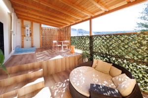 a living room with a couch on a patio at Villa Celeste in Cagliari