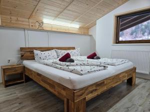 a bedroom with two beds in a room at Gasthof Pension Kohlplatzl in Hopfgarten in Defereggen