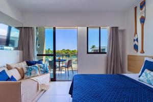 Katil atau katil-katil dalam bilik di Makia Beach #B308 - em Muro Alto por Carpediem +43 gambar
