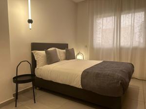 Residence Neya Harhoura tesisinde bir odada yatak veya yataklar