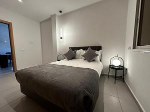 מיטה או מיטות בחדר ב-Residence Neya Harhoura