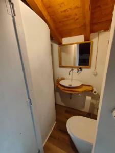 a bathroom with a toilet and a sink at Iancura - B&B di design a Salina in Santa Marina Salina