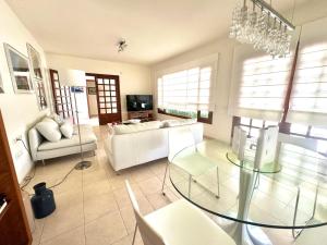 a living room with a glass table and a couch at Luxury Villa Sea Front -La Orilla in Playa Honda +26 photos
