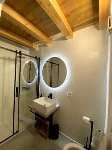 a bathroom with a sink and a shower at Ca'Gialla in Bellinzona +60 photos