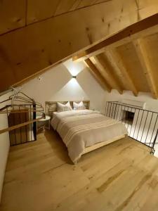 a bedroom with a large bed in a room at Ca'Gialla in Bellinzona