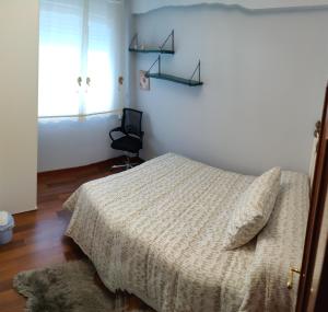 Posteľ alebo postele v izbe v ubytovaní Apartamento Turístico Menéndez Pelayo -Vigo