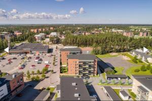 an aerial view of a city with a parking lot at Kempele city center 2 in Kempele