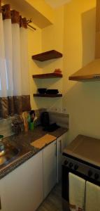 a kitchen with a sink and a counter top at Homes By Sandra in Kilifi