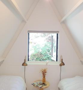 Ένα ή περισσότερα κρεβάτια σε δωμάτιο στο Modern A-Frame vakantiehuis Durbuy Ardennen +29 φωτογραφίες