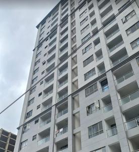 a tall building with many windows on the side of it at Lovella Suites Gold Park in Nairobi