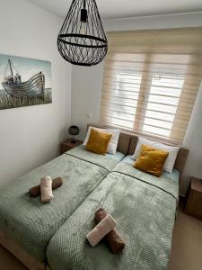 Кровать или кровати в номере Anemos Villa Stegna