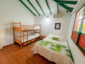 Ένα ή περισσότερα κρεβάτια σε δωμάτιο στο Hotel Barranqueros Soledén