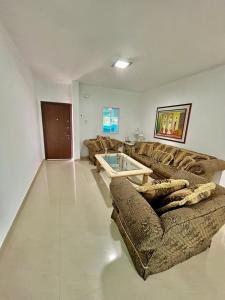 a living room with two couches and a table at Casas Bote in El Morro de Barcelona