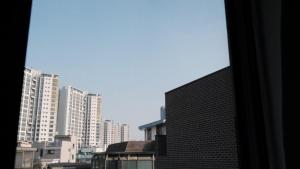a view of a city skyline with tall buildings at Seoul Yes Oui Ja share house in Seoul