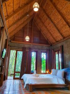 Postel nebo postele na pokoji v ubytování Kung Nok Tha Resort Nakhon Si Thammarat