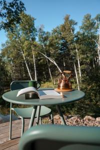 a tea kettle sitting on top of a table at Tofte Trails in Tofte