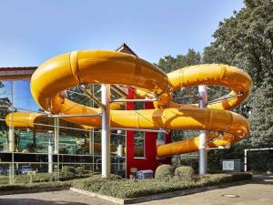 a large inflatable slide in front of a building at Ferienhaus Uelsen in Uelsen