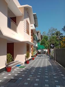 an empty street in a building with potted plants at Casa Branca Retreat in Varkala