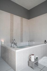 a large bath tub in a bathroom with at Castle Beach in Broughty Ferry